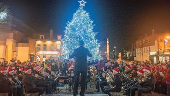 Brass band playing Christmas tunes on the civic centre forecourt