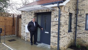 Cllr Steve Tuckwell outside one of the new council homes in Harefield