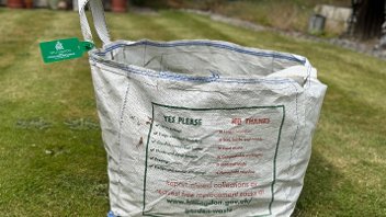 Garden waste bag with tag