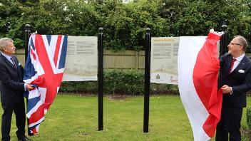HE Professor Arkady Rzegocki,  Ambassador of the Republic of Poland to the Court of St James’s and Cllr Puddifoot MBE, Hillingdon Council’s Armed Forces Champion unveil the new Polish Army boards in the Polish Forces Remembrance Garden in the 